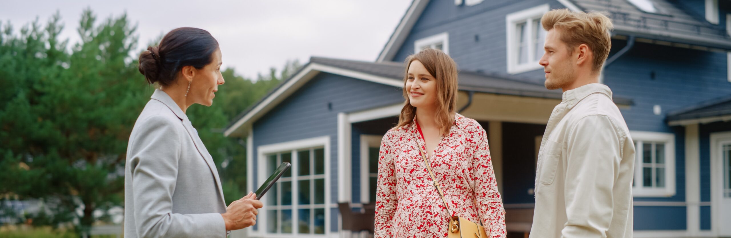 Home buyer couple talking to realtor, inquiring about major components in the prospective home in the Ottawa Valley.